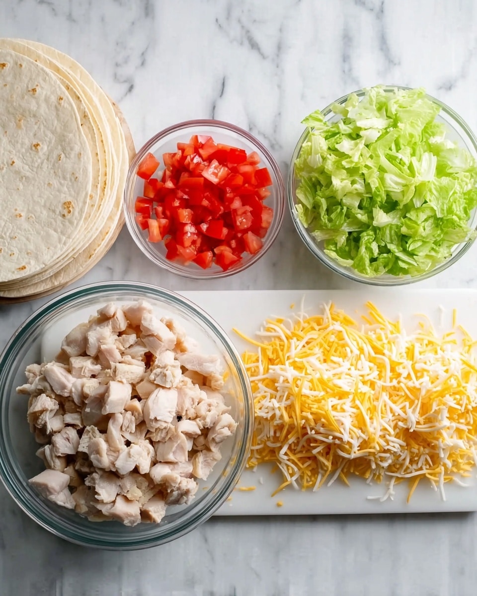 The image shows chopped chicken pieces in a clear glass bowl on the left, finely shredded yellow and white cheese spread out in the center on a white cutting board, small diced red tomatoes in a white bowl above the cheese, and chopped green lettuce in a clear glass bowl to the right. On the far left of the image, there is a stack of white tortillas. All items are on a white marbled surface. photo taken with an iphone --ar 4:5 --v 7