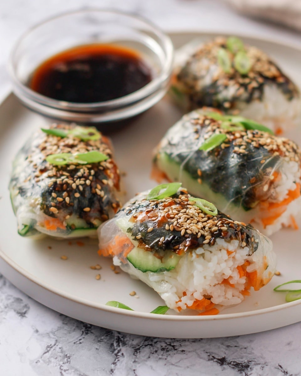 The image shows four translucent rice paper rolls on a white plate, each roll filled with white rice, bright orange carrot strips, dark green seaweed, and cucumber slices. The rolls are sprinkled with toasted sesame seeds and topped with small rings of green onion. Behind the rolls, there is a small clear glass bowl filled with dark soy dipping sauce. The plate is placed on a surface with a white marbled texture. photo taken with an iphone --ar 4:5 --v 7