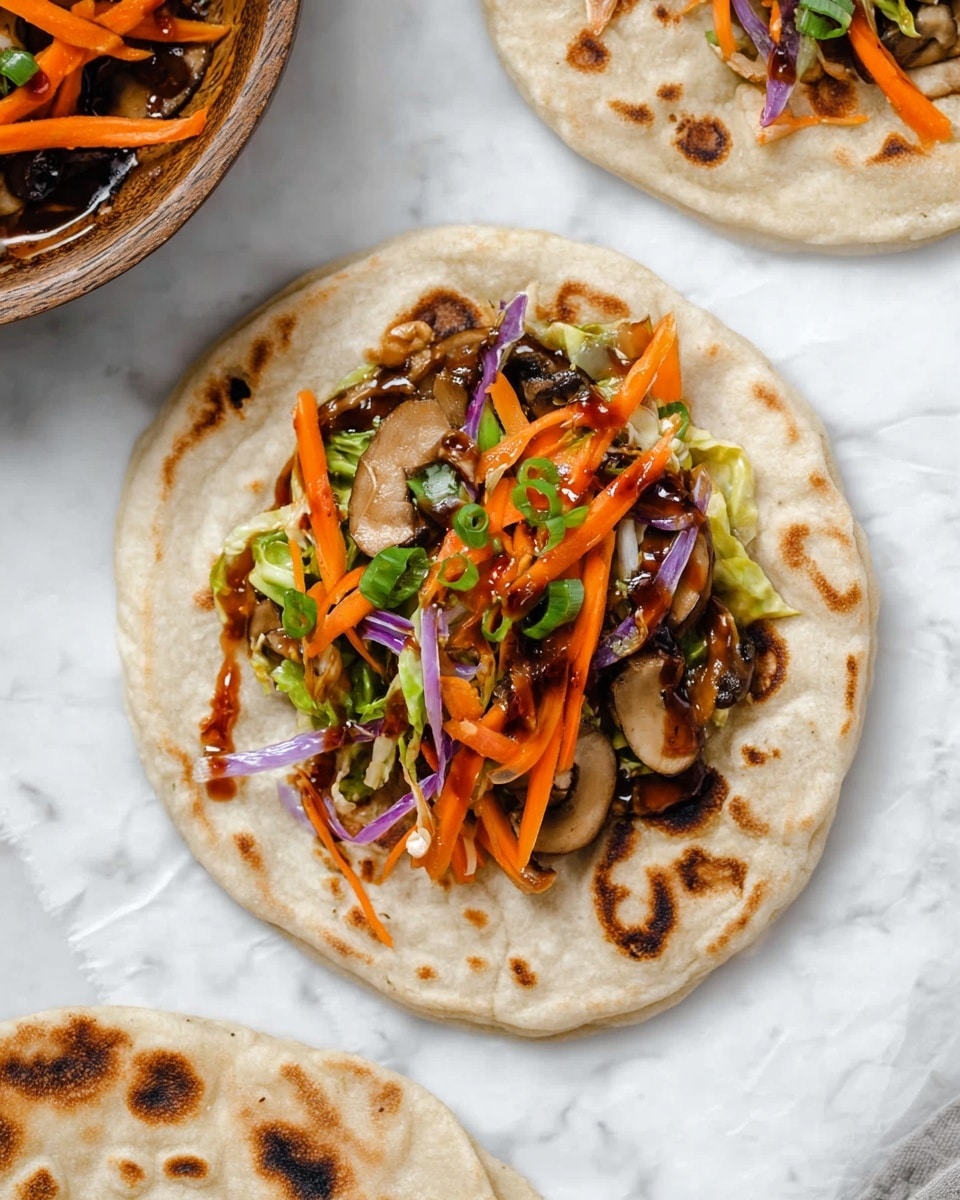 A soft, round flatbread lies open on a white marbled surface, showing a colorful mix of cooked vegetables inside. The bottom layer is the light tan flatbread with brown spots. On top, there is a heap of thin orange carrot strips, light green cabbage pieces, dark brown mushroom slices, light purple onion strips, and bright green chopped scallions. A shiny, dark brown sauce is drizzled over the vegetables, adding a glossy texture. Additional flatbreads with the same light tan and brown spotted look are partially visible around the main one. Photo taken with an iphone --ar 4:5 --v 7