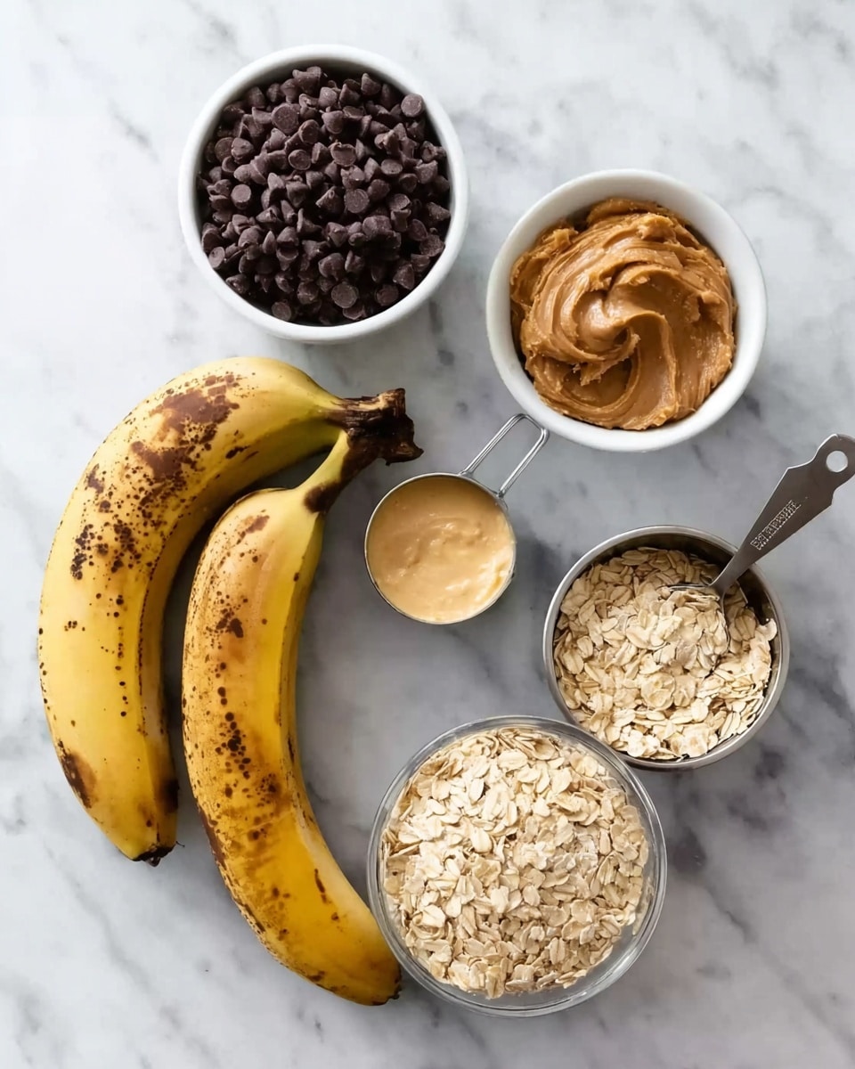 The image shows ingredients placed on a white marbled surface, including two ripe bananas with brown spots, a white bowl full of dark chocolate chips, a small white bowl with a light yellowish creamy substance, a metal measuring cup filled with smooth peanut butter, a metal measuring cup with brown sugar, and a clear white bowl filled with dry oats. The items are arranged neatly, each element distinct and crisp in color and texture, with the bananas positioned diagonally in the bottom left. Photo taken with an iphone --ar 4:5 --v 7