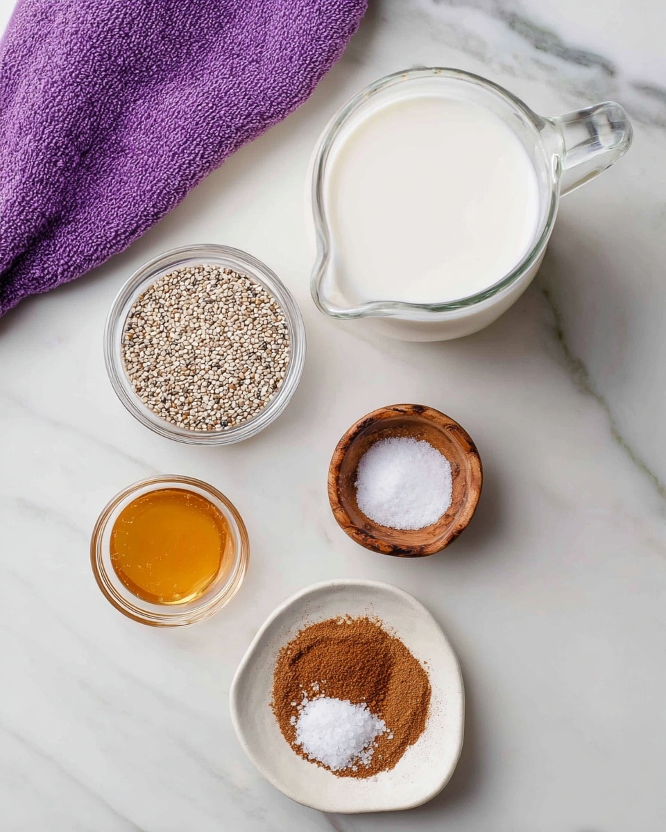 The image shows five small containers arranged on a white marbled surface with a purple towel in the upper left corner. At the top right, there is a clear glass jug filled with white milk. Below it, a small clear glass bowl holds tiny beige chia seeds. To the left, a small clear bowl contains a golden syrup. Below the chia seeds, a white small plate holds a round amount of ground brown cinnamon. Bottom left, a small round wooden bowl contains white salt. All items are neat and clearly separated. Photo taken with an iphone --ar 4:5 --v 7