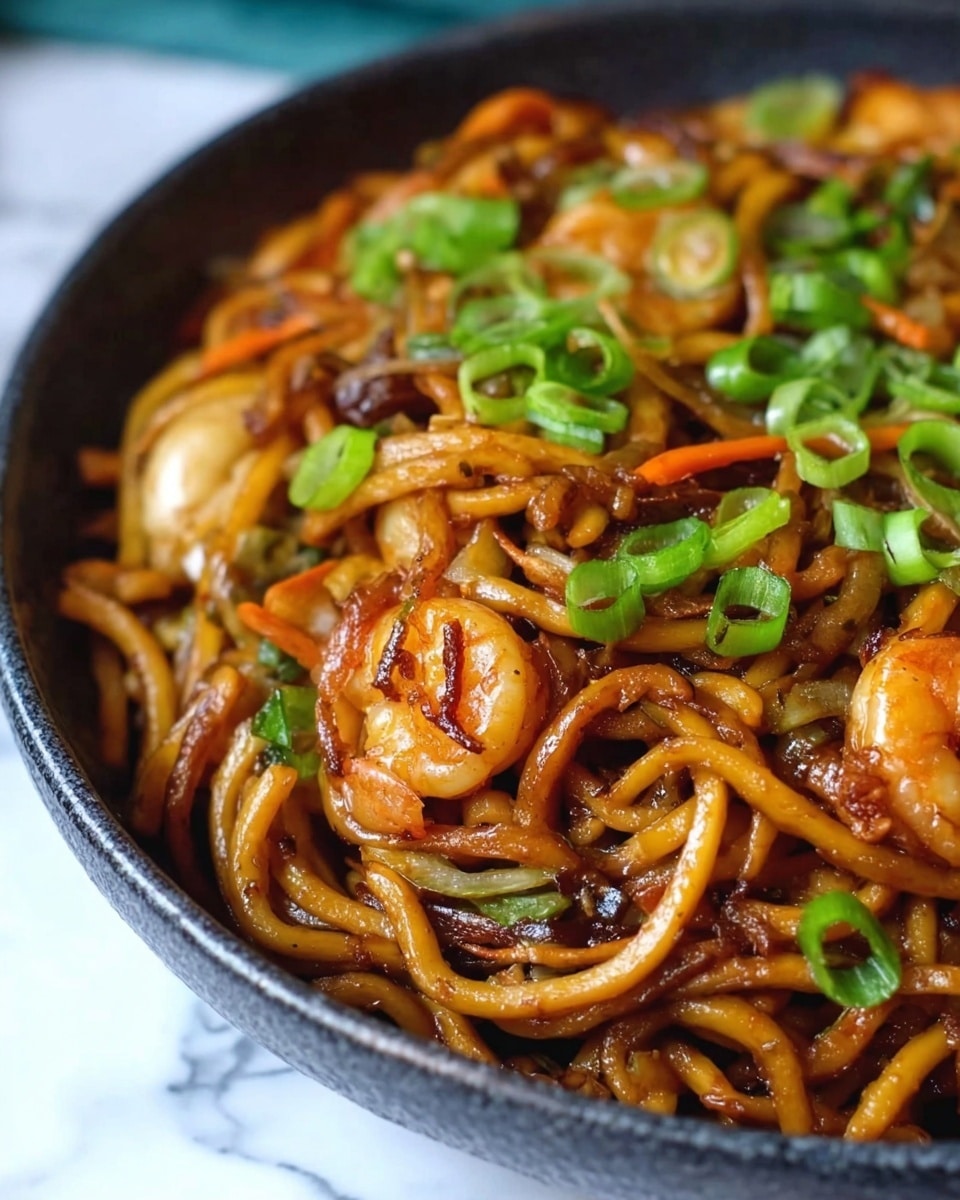 The image shows a close-up of a dark bowl filled with thick brown noodles mixed with small pieces of cooked shrimp and thin slices of vegetables like carrots and onions. The noodles are shiny and look well-cooked, with a slightly oily texture. Bright green slices of fresh green onions are sprinkled on top, adding a pop of color. The bowl is placed on a white marbled surface, and a blurred background gives focus to the food. Photo taken with an iphone --ar 4:5 --v 7