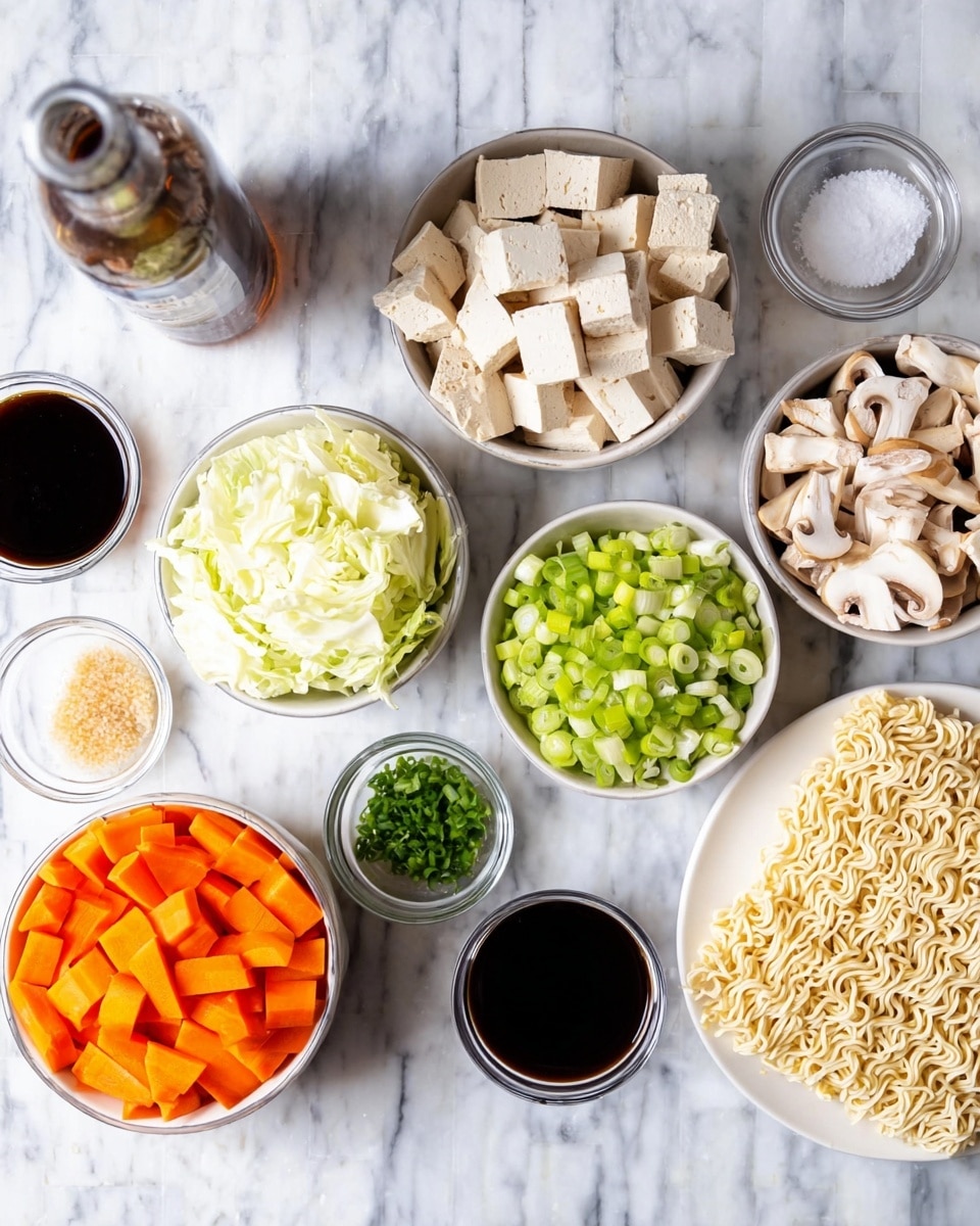 A top view of many small white bowls on a white marbled surface, each filled with different ingredients: a bowl with light beige tofu cut into small thick sticks, a bigger bowl with white cabbage pieces and sliced light brown mushrooms, a bowl with bright orange sliced carrots, a bowl with chopped green spring onions, a bowl with a mix of white sugar, salt, and pepper, a bowl with finely chopped green herbs, a bowl with dark brown soy sauce, a white plate holding light beige instant noodles, and a glass bottle with dark liquid near the top left corner. photo taken with an iphone --ar 4:5 --v 7