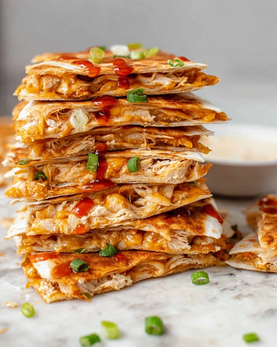 A tall stack of eight golden brown quesadilla pieces is shown on a white marbled surface. Each layer has melted cheese and shredded chicken inside warm tortillas, with slight browning on the edges. Small pieces of green onion are sprinkled between layers and on top for color. A drizzle of red sauce runs down the upper layers, adding a splash of vibrant contrast. A small white bowl with creamy dip is blurred in the background. The textures look soft inside and crispy on the outside. Photo taken with an iphone --ar 4:5 --v 7