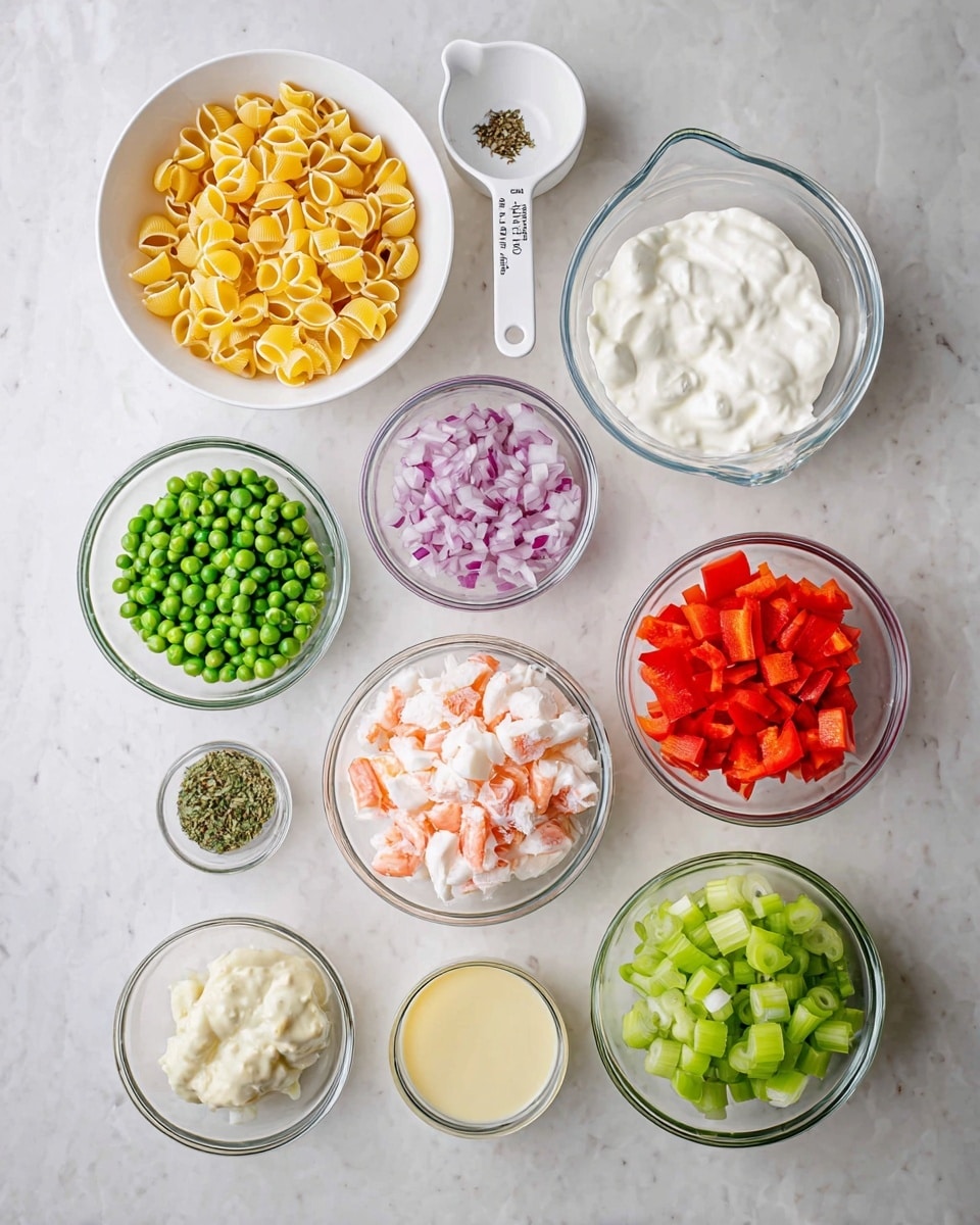 The image shows a top view of nine small bowls and cups arranged on a white marbled surface. Starting from the top left, there is one white bowl filled with small yellow pasta shells, then a white measuring cup with chopped red onions, and a clear glass bowl with thick white yogurt. Below them, a small white bowl holds dried green herbs, next to a clear glass bowl filled with chopped red bell peppers, and another clear glass bowl with a creamy white sauce. At the bottom left, a white measuring cup holds green peas, followed by a small clear cup with a light yellow liquid, a large clear bowl filled with chopped crab sticks, and lastly, another clear glass bowl with chopped green celery. All containers are neatly placed in rows with clear color contrast between the ingredients photo taken with an iphone --ar 4:5 --v 7