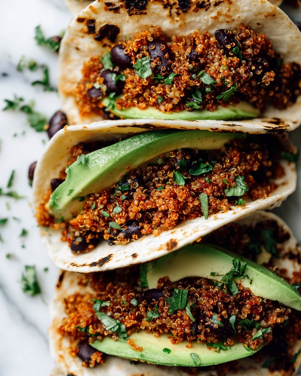 The image shows a close-up of several white tortillas each folded and filled with two main layers: the bottom layer is a bright green smooth avocado sliced thinly, and the top layer is a textured mix of fluffy reddish-orange quinoa and black beans, garnished with small bits of green herbs scattered on top. The tortillas have slight char marks on the edges adding a toasted look while the background is a white marbled surface with some small scattered herbs, giving a fresh and colorful presentation. photo taken with an iphone --ar 4:5 --v 7