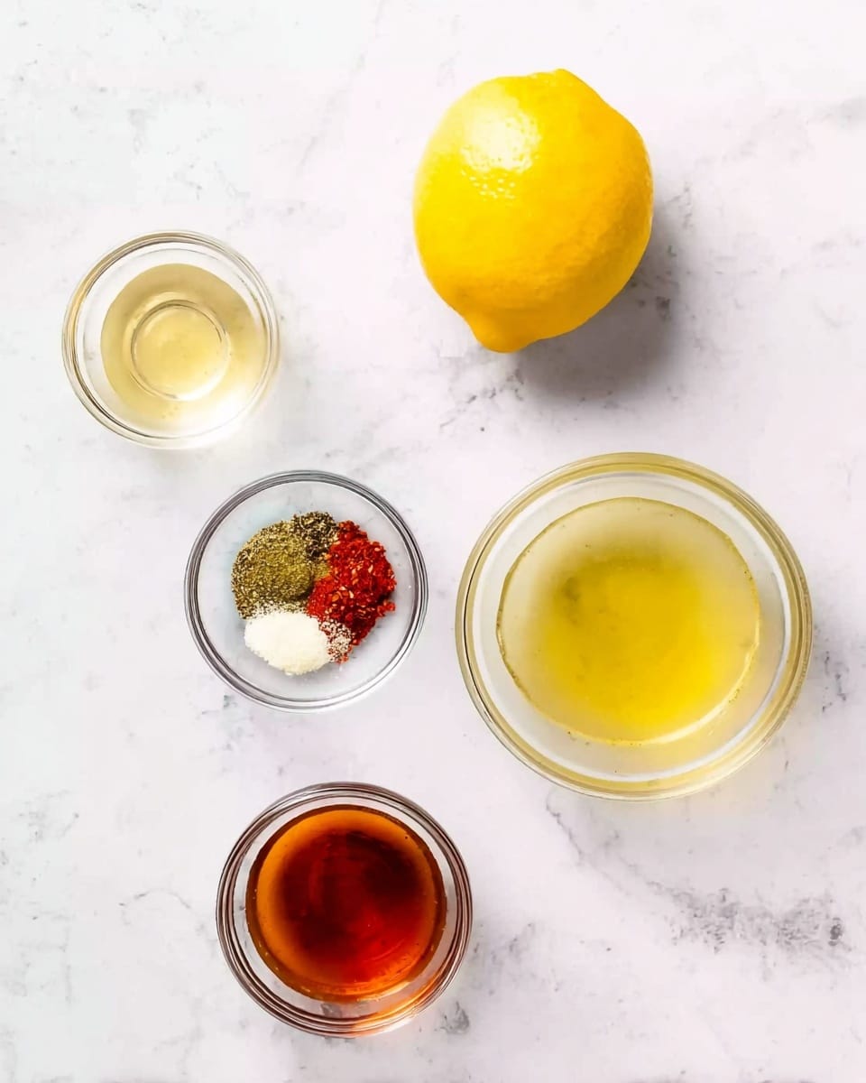 The image shows six ingredients arranged on a white marbled surface. At the top right, there is a whole bright yellow lemon. To its left, there is a small clear glass bowl with a light yellow liquid. Below this, there is a larger clear bowl filled with a slightly greenish-yellow liquid. Below and slightly to the left, there is a small clear bowl containing a mix of spices in different colors including red, green, and white. To the left of this bowl, there is a small clear bowl with a dark amber-brown liquid. All the bowls are clear glass and placed neatly apart. The whole scene is bright and clean. photo taken with an iphone --ar 4:5 --v 7