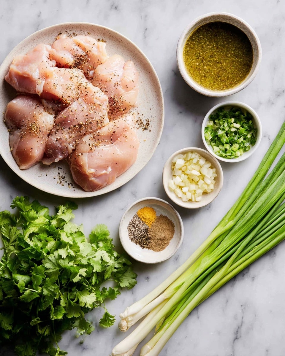 A white round plate on the left side holds several pieces of raw chicken with a light pink color, sprinkled with black pepper. To the right of the plate, there is a white marbled surface with five items arranged, including a small white bowl with green sauce at the top right, a small white bowl with chopped garlic and green chili just below it, another small white bowl containing mixed spices including black, yellow, and beige powders just below the chopped garlic, a bunch of fresh green cilantro on the bottom left side, and a cluster of long green onions with white bases laying horizontally on the right side of the image. Photo taken with an iphone --ar 4:5 --v 7