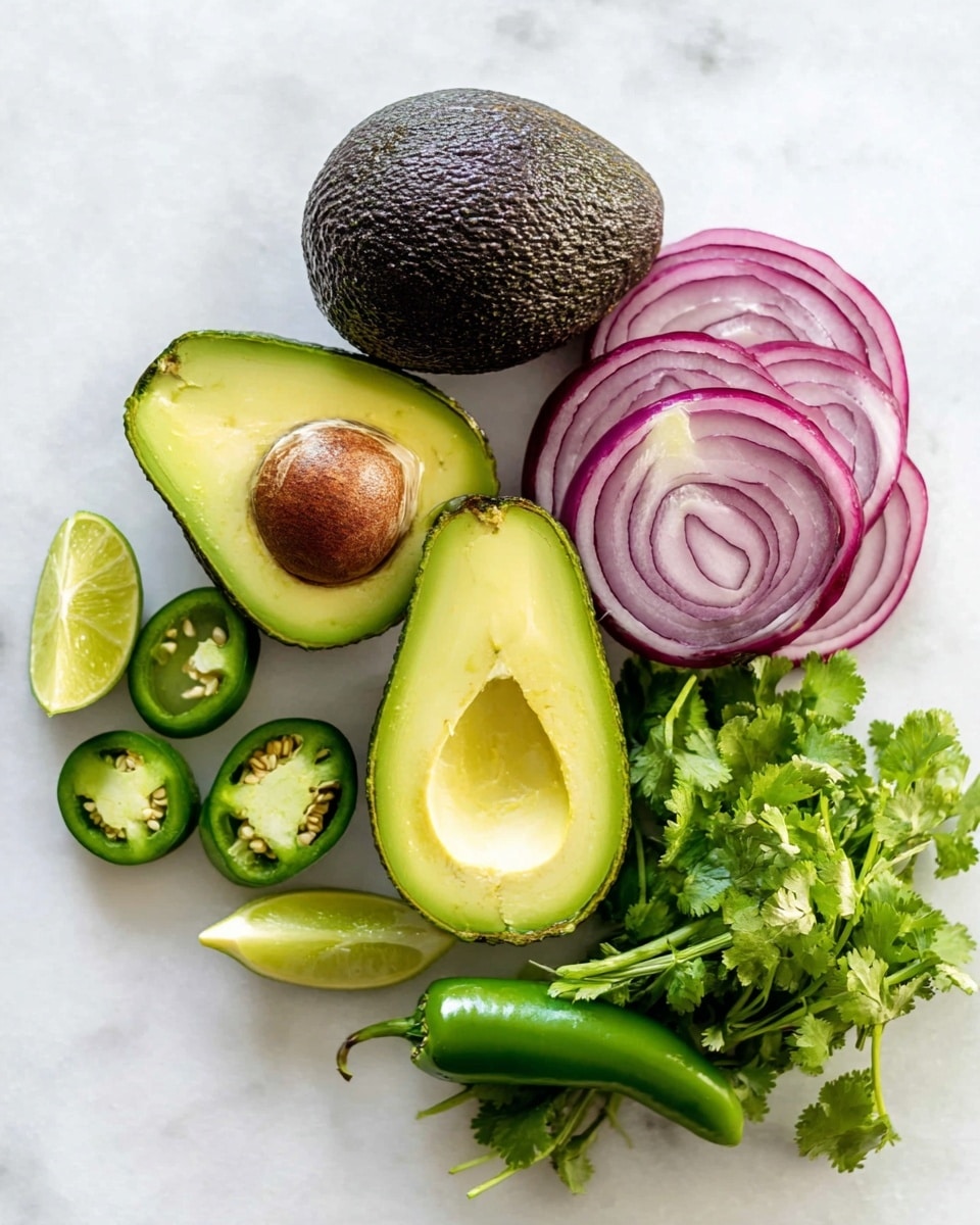 The image shows fresh ingredients arranged on a white marbled texture. There is one whole avocado with bumpy dark green skin and two avocado halves showing a smooth light green interior with one half having a large brown seed in the center. Above the avocados, there is a sliced red onion showing its purple and white concentric rings. To the right, a bunch of bright green fresh cilantro with leafy tops and long stems is placed. Below the avocados, two halves of a green jalapeño pepper are cut open, displaying their pale green flesh and white seeds inside. Also, two lime halves with a juicy, light green interior are positioned near the jalapeños. The background is clean, emphasizing the bright fresh colors of the ingredients. photo taken with an iphone --ar 4:5 --v 7