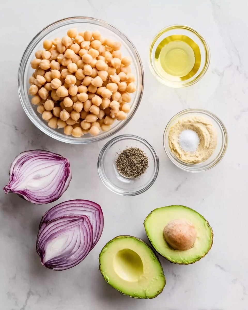 The image shows six glass bowls and two avocado halves arranged neatly on a white marbled surface. The largest bowl at the bottom holds light beige chickpeas filled to the top. Above, a small bowl contains black pepper, and another holds a white powder seasoning. To the right, a small bowl has light beige creamy paste, while above it, a bowl is filled with a light yellow liquid, possibly lemon juice. On the left, a halved red onion with white and purple lines is shown, and next to it, two green avocado halves with smooth flesh and a large seed inside one half are placed. The overall layout is clean and bright with focus on the fresh ingredients photo taken with an iphone --ar 4:5 --v 7