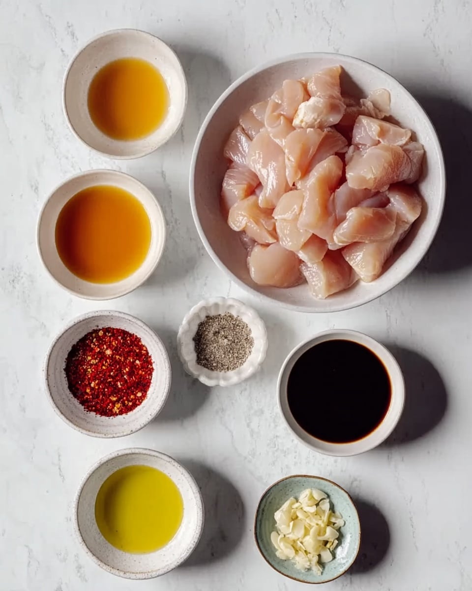 A white bowl filled with raw pieces of light pink chicken, placed at the top center of the image. Below it, arranged in two rows on a white marbled surface, are six smaller white bowls and dishes: the top row has a bowl of clear orange liquid on the left, a tiny bowl of red chili flakes in the middle, and a bowl of thick dark soy sauce on the right. The bottom row includes a bowl of light yellow oil on the left, a small dish of salt and pepper in the middle, and a round dish with minced garlic on the right. The bowls and dishes are neat and evenly spaced, all resting on the clean white marbled surface photo taken with an iphone --ar 4:5 --v 7