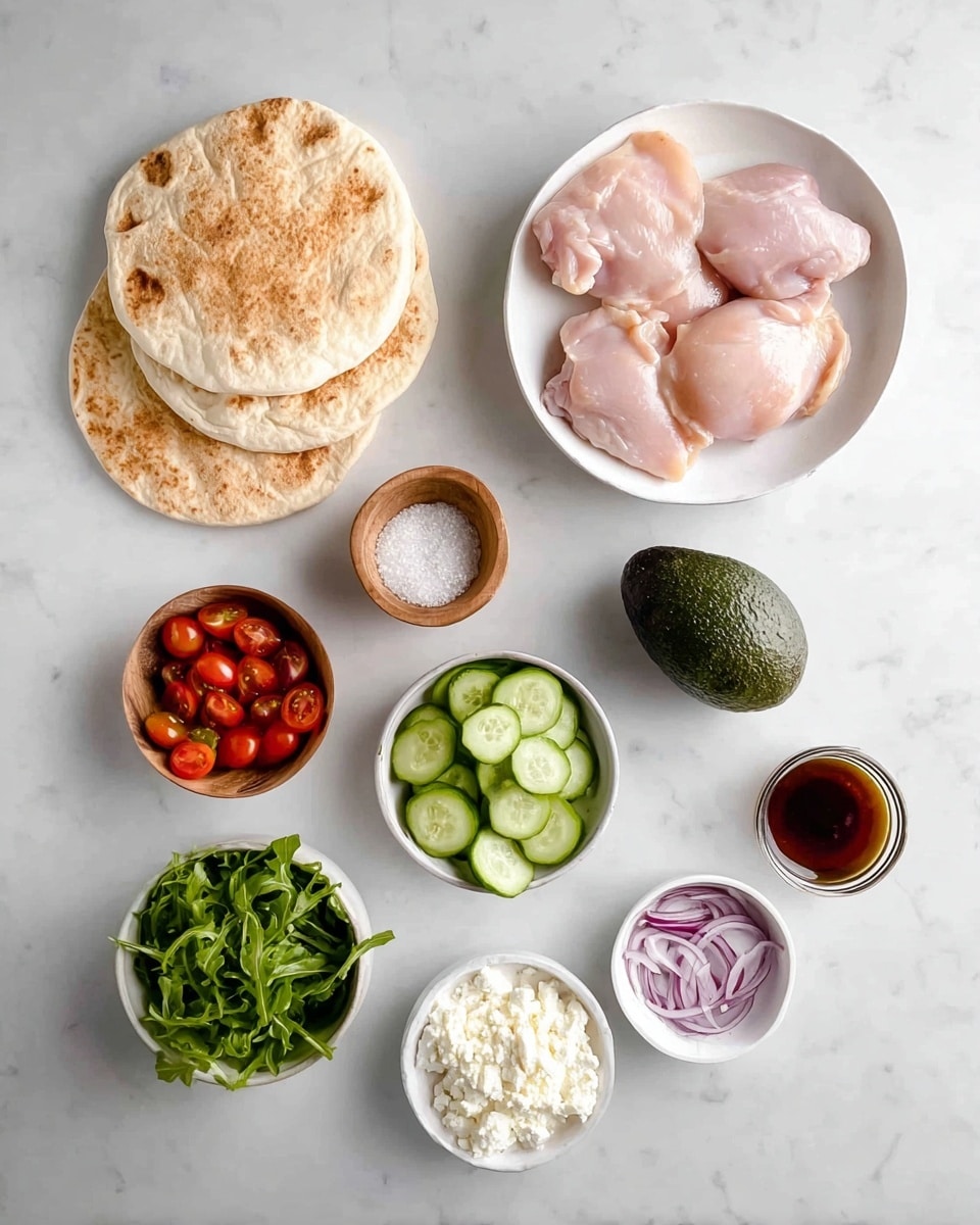 The image shows four round pita breads stacked on the left on a white marbled surface. On the right is a white bowl holding four raw chicken thighs with a pinkish color. Below that, a whole dark green avocado sits alone. Next to the avocado is a small wooden bowl with white salt and black pepper. Below, there's a small white bowl filled with cucumber slices, another bowl with green arugula leaves, a small bowl with cherry tomatoes cut in halves, a smallest bowl with creamy white sauce, a small bowl with white crumbly cheese, and a small bowl with thinly sliced red onions. Also present is a small cup containing a dark brown dressing or sauce. The ingredients are well-arranged and spaced neatly on the white marbled surface. Photo taken with an iphone --ar 4:5 --v 7