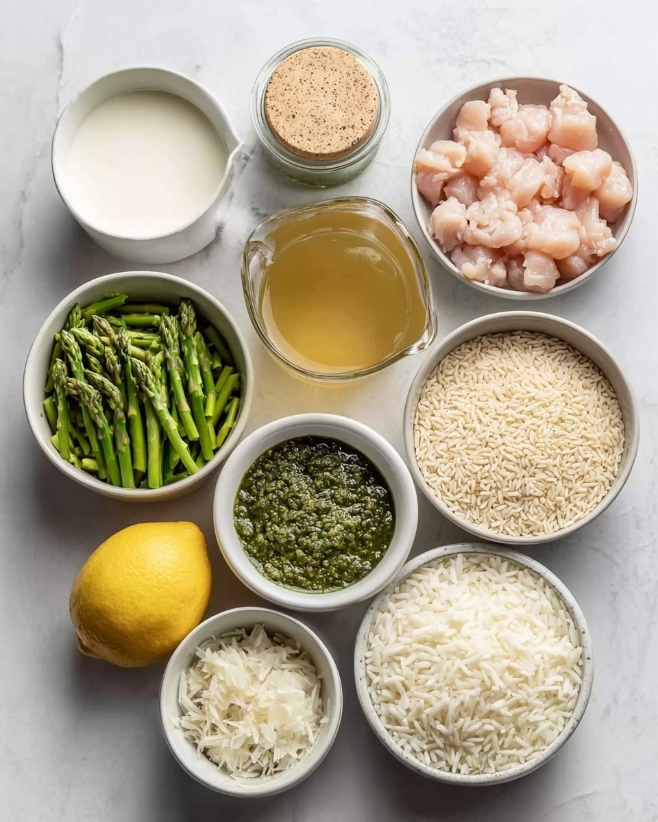 The image shows nine white bowls arranged on a white marbled surface. One bowl contains small, raw light pink chicken pieces in the top right. Next to it is a glass jar with a beige lid filled with pepper. Near the top left, a white bowl holds a creamy white substance, likely yogurt or cream. Below this is a transparent jug filled with golden broth and beside it a whole yellow lemon, two garlic cloves, and a small white bowl with dark green pesto sauce. A bowl with bright green chopped asparagus pieces sits left of the broth. To the right of the asparagus is a bowl with uncooked light beige rice grains. In the bottom left is a bowl with grated white cheese, and to the right is a bowl filled with finely chopped white onions. Photo taken with an iphone --ar 4:5 --v 7