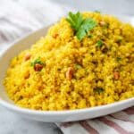 Turmeric Couscous with Golden Raisins, Mint, and Toasted Pine Nuts Recipe