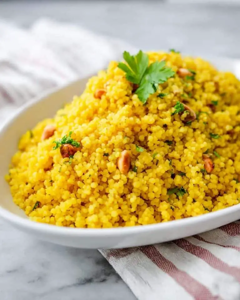 Turmeric Couscous with Golden Raisins, Mint, and Toasted Pine Nuts Recipe