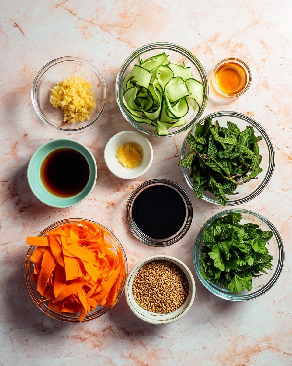 The image shows nine glass bowls arranged on a white marbled surface, each bowl containing a different ingredient. At the bottom left is a bowl filled with bright orange carrot ribbons, soft and thinly sliced. Next to it on the right is a bowl with curled light green cucumber ribbons showing both their dark green skin and pale flesh. Above the cucumber, there is a small bowl with finely minced light yellow garlic. To its right, a small bowl holds a light amber liquid, possibly honey or syrup. Above this is another small bowl with a dark brown liquid that looks like soy sauce. In the center, there is a small white ceramic bowl filled with toasted sesame seeds in light brown color. To the left of it, a bowl contains dark green fresh mint leaves. Next to the mint is a bowl with fresh cilantro leaves that are a vivid green. Finally, at the top right, there is an empty small bowl. All the bowls are clear and the colors of the ingredients are bright and fresh. photo taken with an iphone --ar 4:5 --v 7